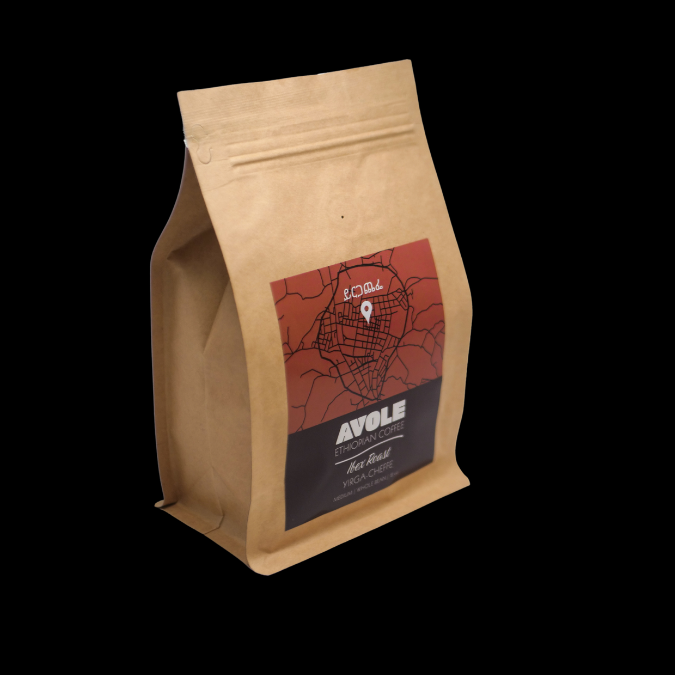 A brown bag of coffee with a logo showing a map of an ethiopian coffee region. 